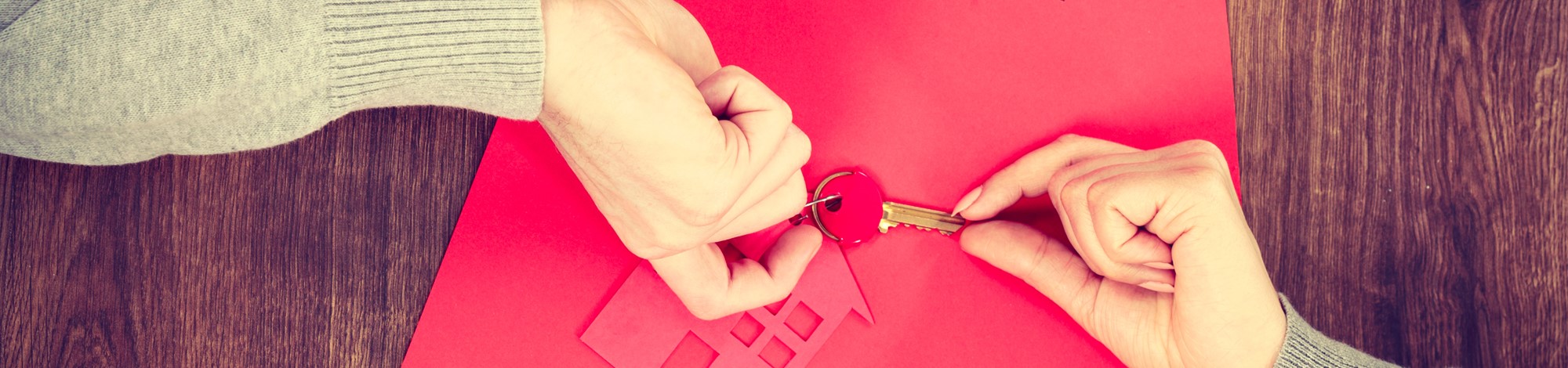 Pair of hands holding a key