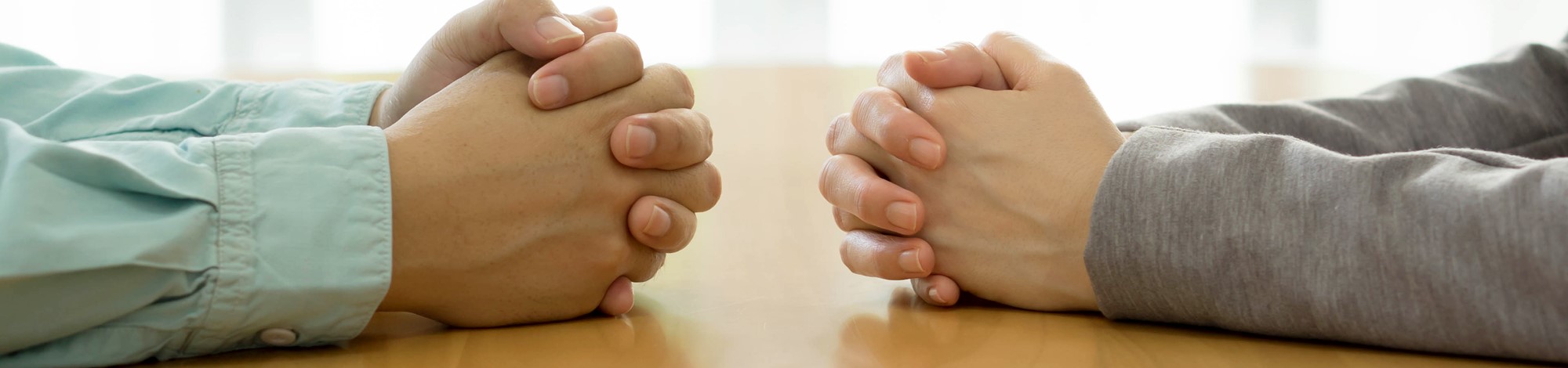 Hands at negotiating table