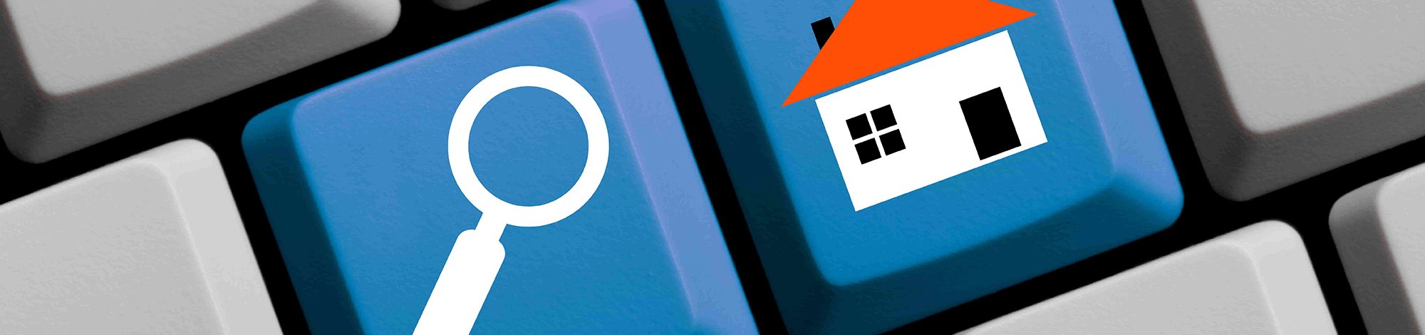 Keyboard with a house and a magnifying glass icon