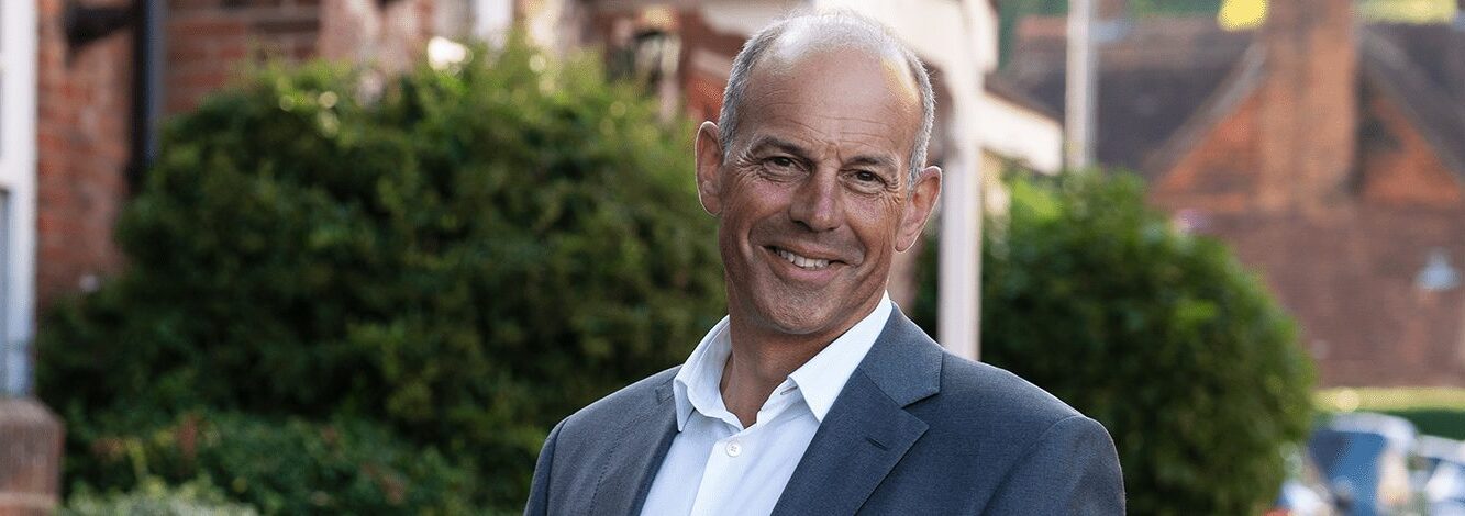 Phil Spencer outside a property