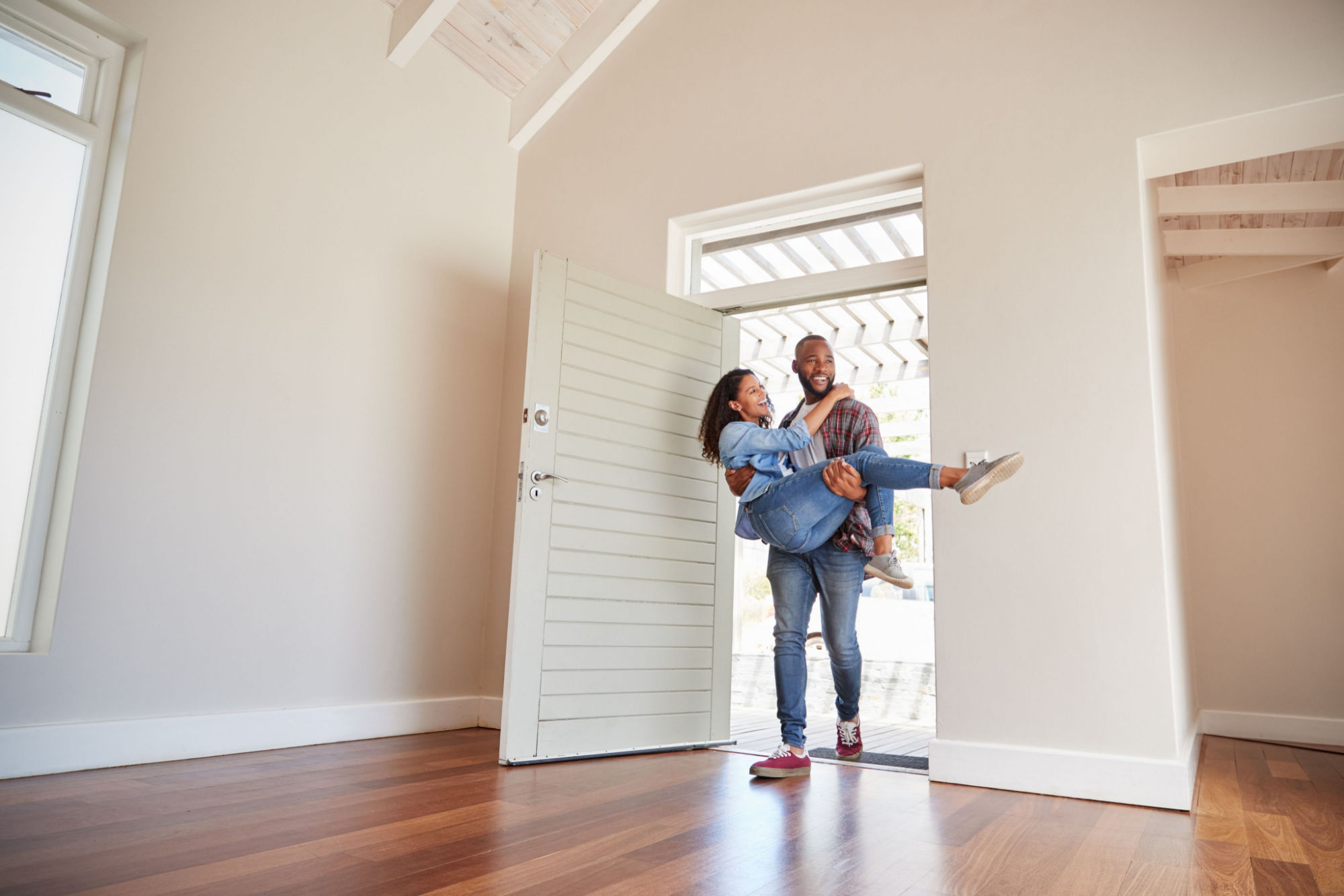 man-carrying-woman-over-threshold-doorway-1