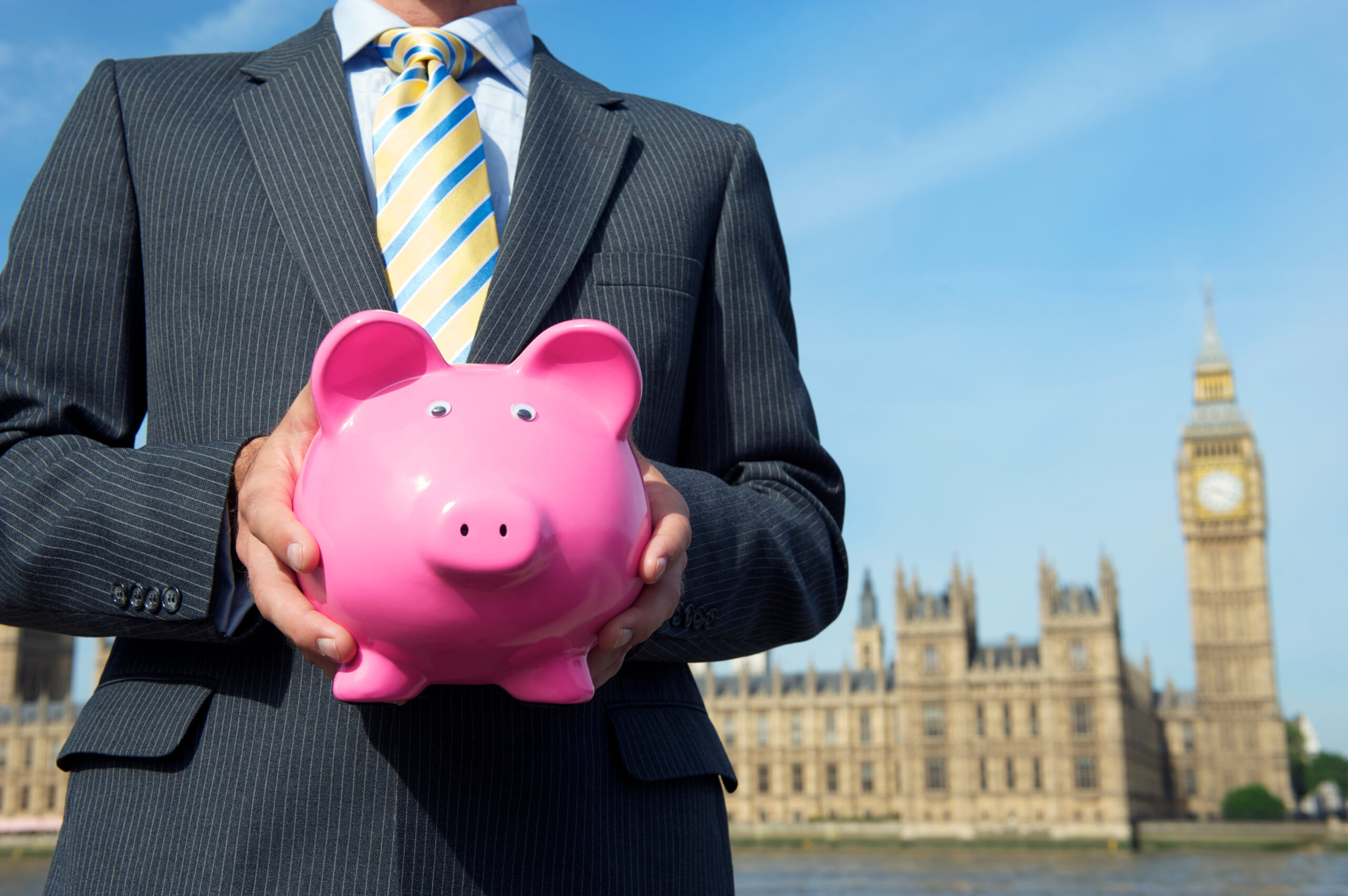 spring-budget-british-politician-holding-classic-pink-piggy