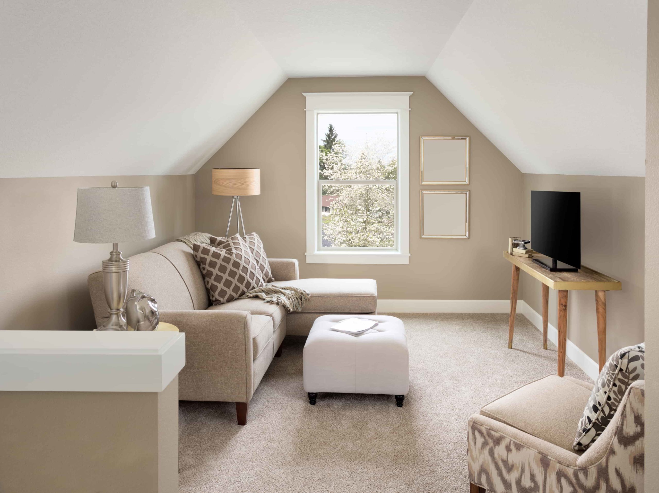 Beautiful small living room interior and loft in new home with sloping roof