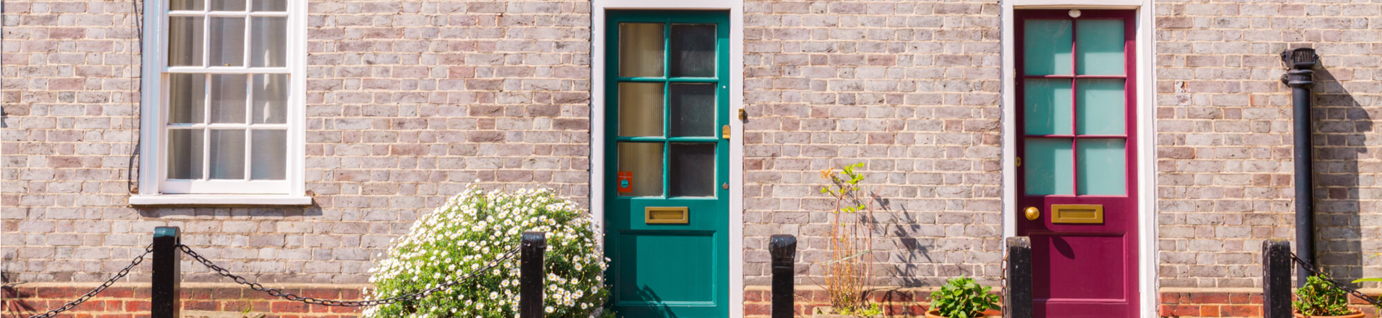 victorian-brick-house-with-colored-doors