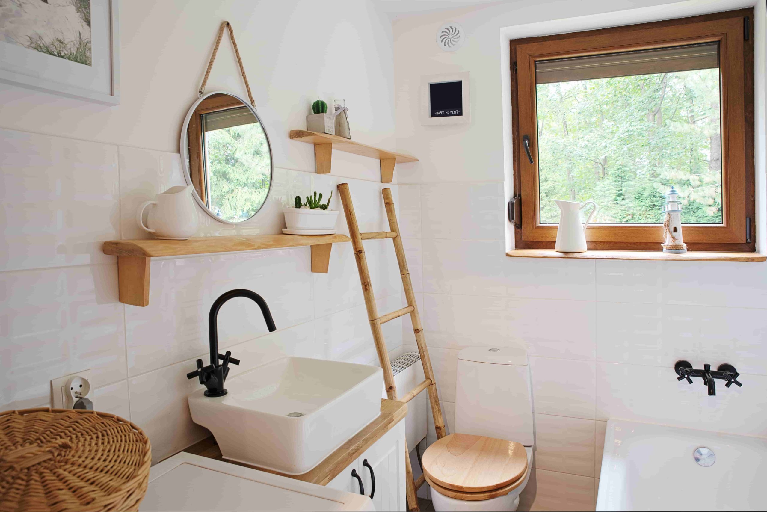 Small bathroom with washbasin and window in a cottage