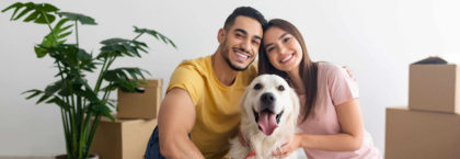 young-couple with-golden-retriever-dog-rental-place