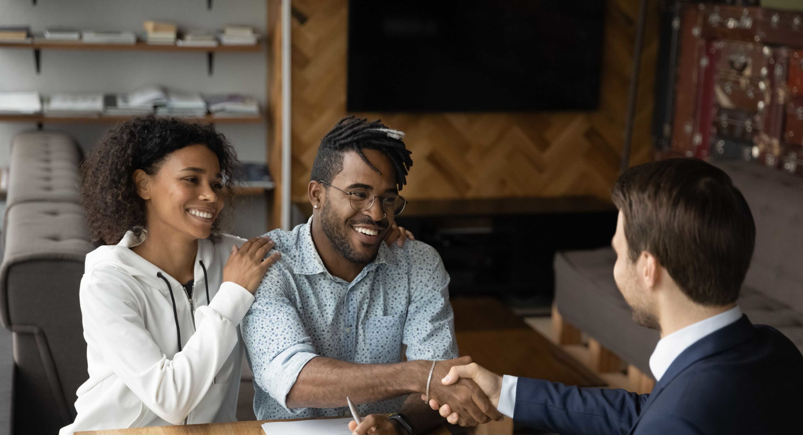 couple-handshake-with-male-broker-joint-mortgage